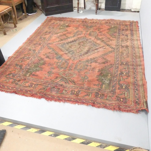 2133 - A red-ground Bokhara carpet. 265x213cm.