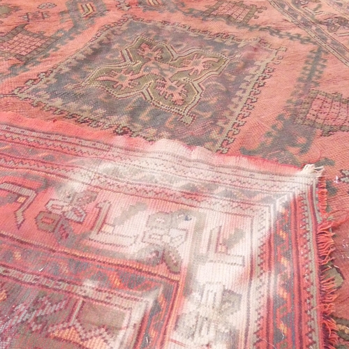 2133 - A red-ground Bokhara carpet. 265x213cm.