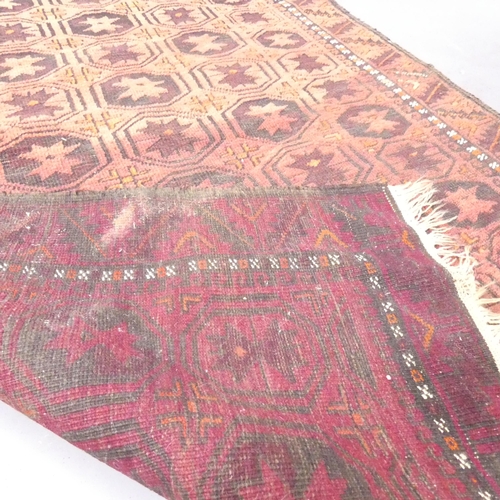 2134 - A red-ground Tekke rug. 202x106cm.