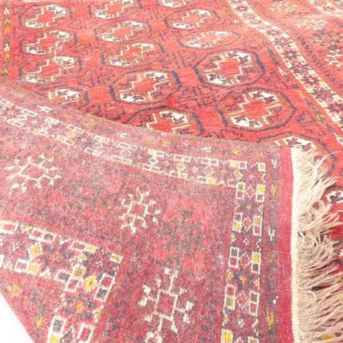 2135 - A red-ground Tekke rug. 144x112cm