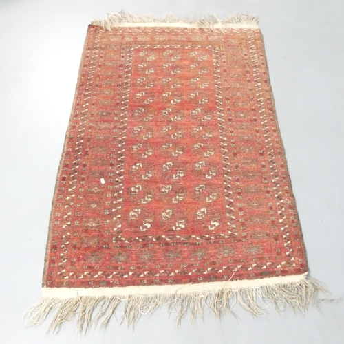 2136 - A red-ground Tekke rug. 142x100cm.