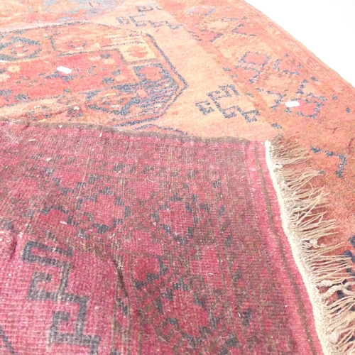 2137 - A red-ground Afghan rug. 149x102cm.