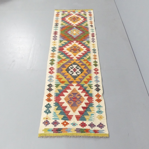 2144 - A Chobi Kilim runner/ 198x57cm.