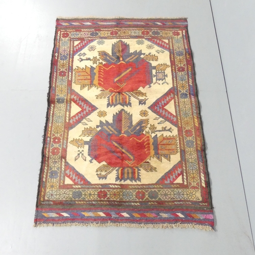 2147 - A cream-ground Baluchi rug. 130x84cm.