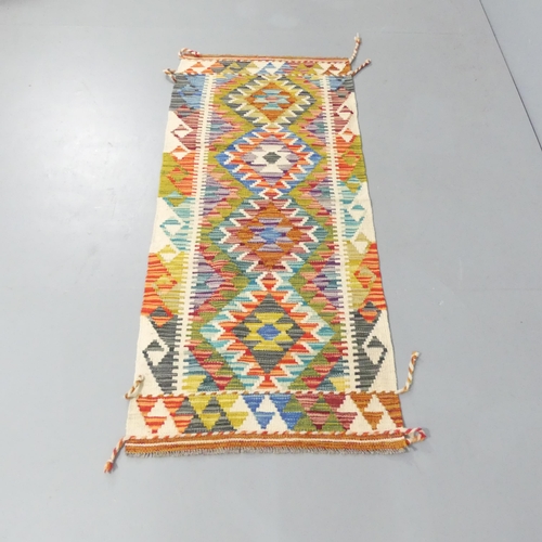 2148 - A Chobi Kilim runner. 148x64cm.