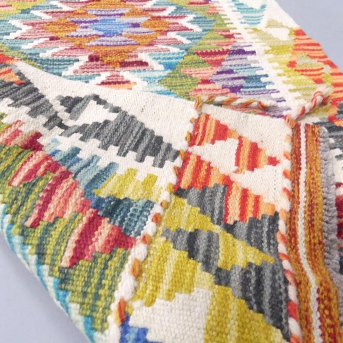 2148 - A Chobi Kilim runner. 148x64cm.