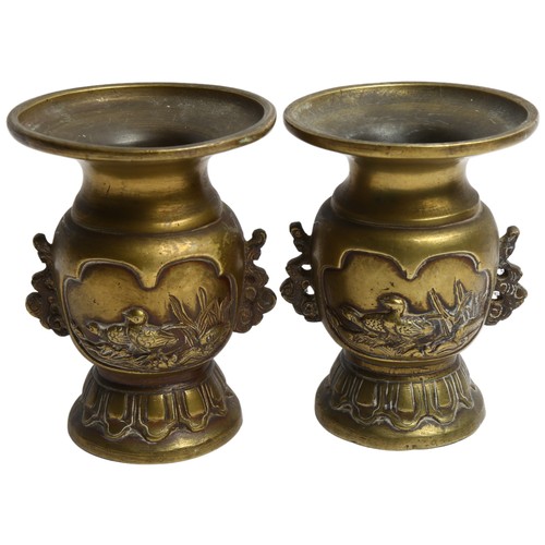 162 - A pair of 20th century Japanese bronze vases, embossed bird decoration and lotus base, H12cm