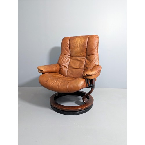 2151 - EKORNES - A Stressless Mayfair reclining armchair in brown leather, with maker's marks and badges.