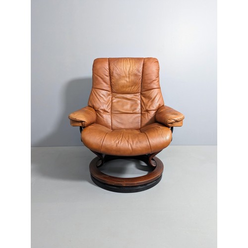 2151 - EKORNES - A Stressless Mayfair reclining armchair in brown leather, with maker's marks and badges.