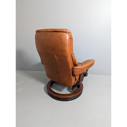 2151 - EKORNES - A Stressless Mayfair reclining armchair in brown leather, with maker's marks and badges.