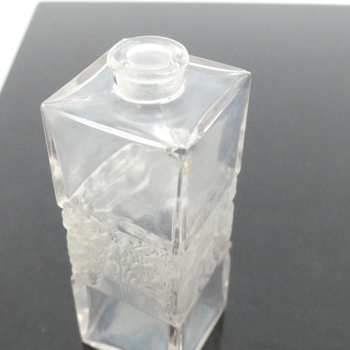 487 - R LALIQUE FRANCE - a rectangular scent bottle and stopper, having a moulded child and tree design ce... 