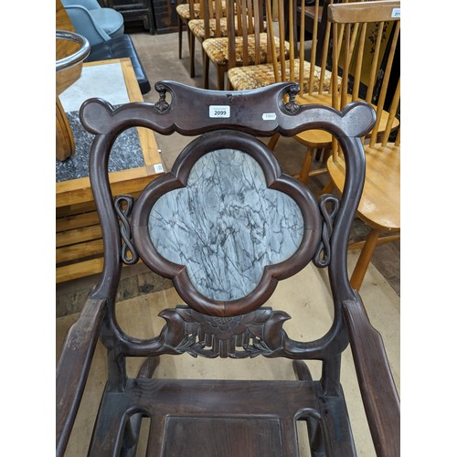 2099 - A Chinese hardwood lounge chair, with marble panelled back and carved and pierced decoration. Overal... 