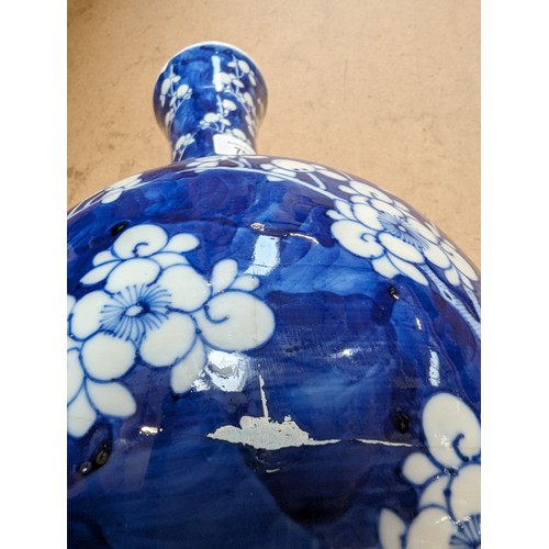 797 - A Chinese blue and white Prunus pattern vase, with 4 character mark, H35cm, repaired rim chip and cr... 