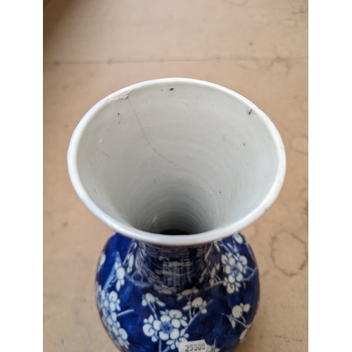 797 - A Chinese blue and white Prunus pattern vase, with 4 character mark, H35cm, repaired rim chip and cr... 