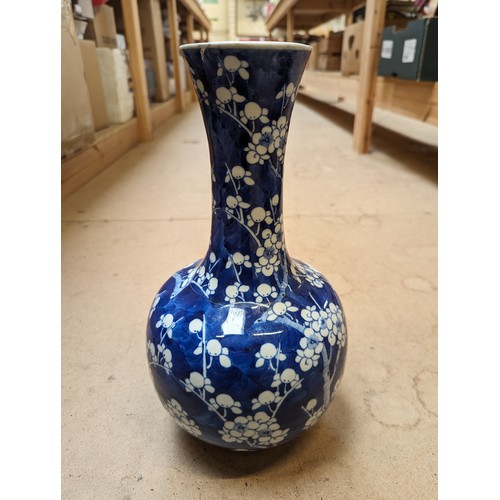 797 - A Chinese blue and white Prunus pattern vase, with 4 character mark, H35cm, repaired rim chip and cr... 