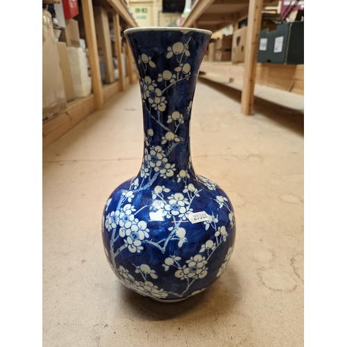 797 - A Chinese blue and white Prunus pattern vase, with 4 character mark, H35cm, repaired rim chip and cr... 