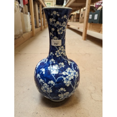 797 - A Chinese blue and white Prunus pattern vase, with 4 character mark, H35cm, repaired rim chip and cr... 