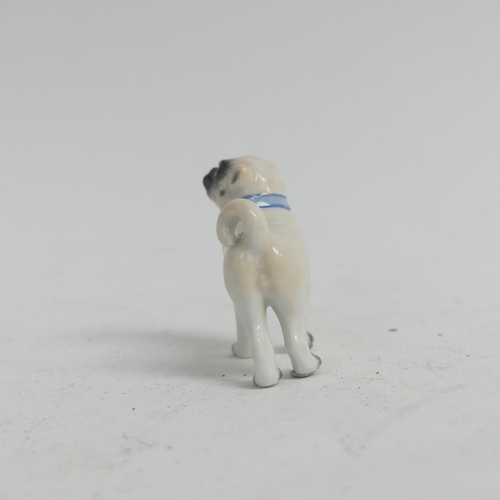 1097 - A group of 3 Meissen porcelain dog figurines, all stamped to the underside with crossed blue swords,... 