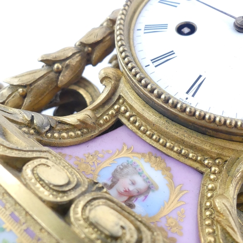 59 - An ornate 19th century gilt-bronze mantel clock, an 8-day striking movement, and ceramic panels, ser... 