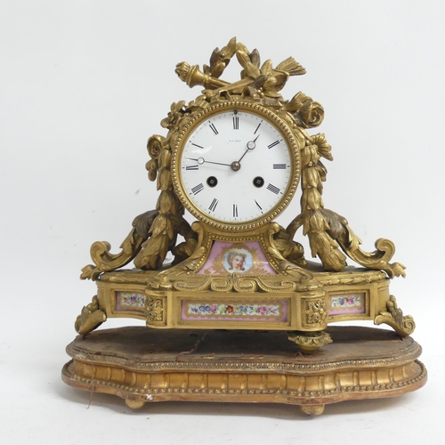59 - An ornate 19th century gilt-bronze mantel clock, an 8-day striking movement, and ceramic panels, ser... 