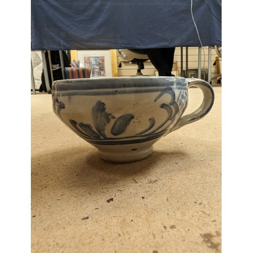 714 - 3 pieces of Studio pottery, Seth Cardew cup and saucer and a large Abuja pottery tankard, both with ... 