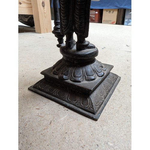 564 - A bronze sculpture of Indian deity Vishnu, on a stand with lotus leaf decoration, H31cm