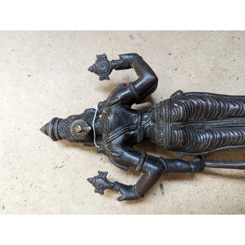 564 - A bronze sculpture of Indian deity Vishnu, on a stand with lotus leaf decoration, H31cm