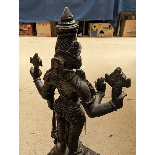 564 - A bronze sculpture of Indian deity Vishnu, on a stand with lotus leaf decoration, H31cm