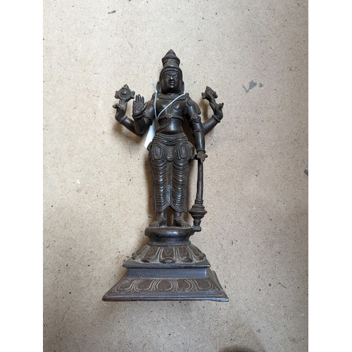 564 - A bronze sculpture of Indian deity Vishnu, on a stand with lotus leaf decoration, H31cm