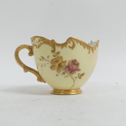 1075 - A Royal Worcester Blush Ivory Empress tea cup and saucer,  decorated with sprays of flowers, with pi... 