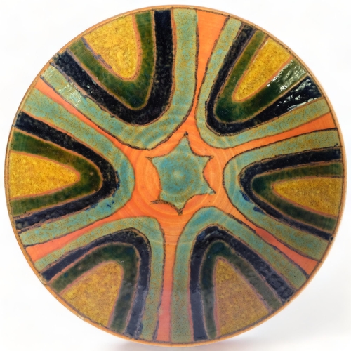 114 - Poole Pottery, a Poole Studio charger, c.1964-66, makers mark to base, diameter 27cm