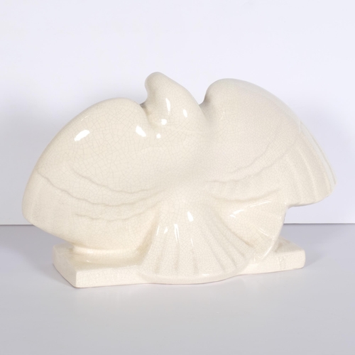 135 - A early/mid 20th century ceramic sculpture of doves, makers mark on reverse WH, indistinct 