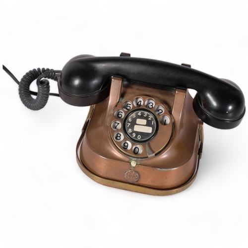 142 - A vintage FTR copper and brass body dial telephone