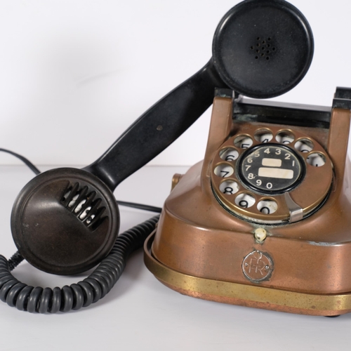 142 - A vintage FTR copper and brass body dial telephone