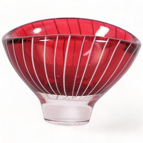 169 - Vicke Lindstrand for Kosta, a small oval shaped bowl in ruby red glass overlain with white milk glas... 