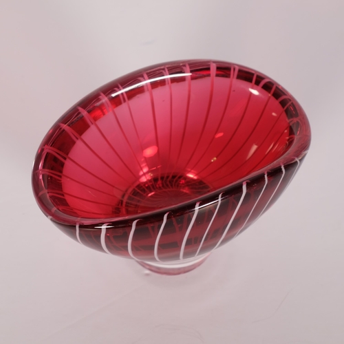 169 - Vicke Lindstrand for Kosta, a small oval shaped bowl in ruby red glass overlain with white milk glas... 