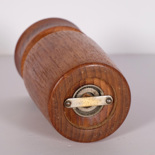 172 - A Danish pepper grinder with an inlaid knob and brass securing nut, height 13cm