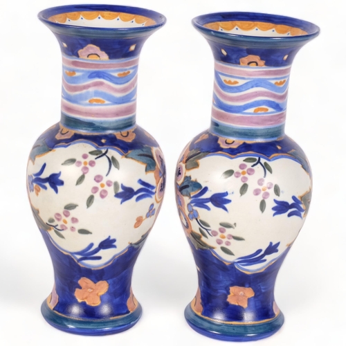 185 - A pair of Carlton Ware bulbous vases from the Handcraft range, decorated in Floribunda pattern 3236,... 