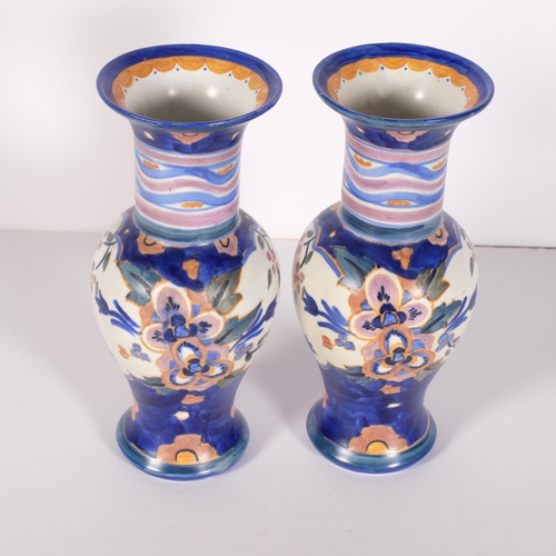 185 - A pair of Carlton Ware bulbous vases from the Handcraft range, decorated in Floribunda pattern 3236,... 