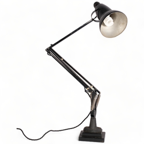 195 - A Herbert Terry, black Anglepoise lamp, originally bench mounted, now mounted on two-step iron block... 