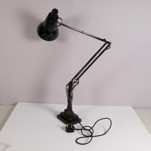 195 - A Herbert Terry, black Anglepoise lamp, originally bench mounted, now mounted on two-step iron block... 