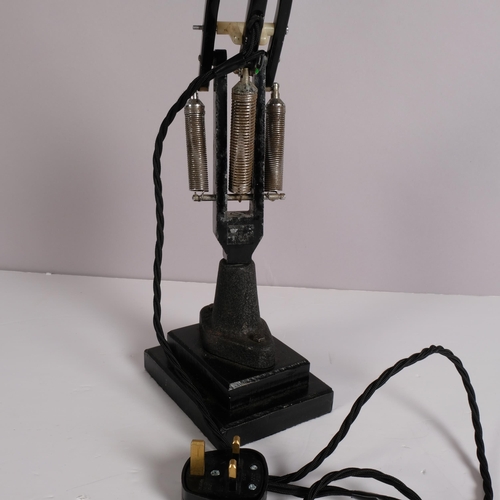 195 - A Herbert Terry, black Anglepoise lamp, originally bench mounted, now mounted on two-step iron block... 