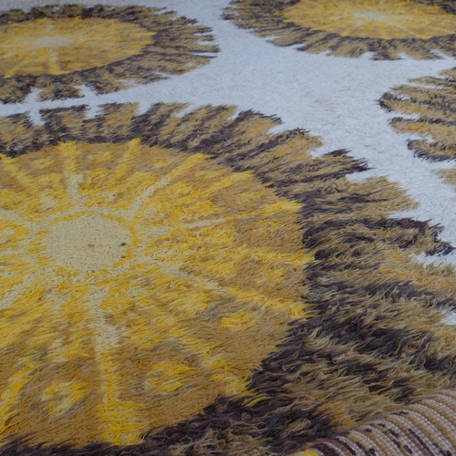 197 - A 1960s' large Axminster, Rya style rug, with repeating sun pattern, 370 x 245cm