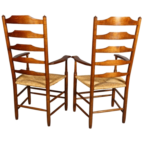 2 - Lawrence Neal, Stockton, a pair of hand made Clisset Nr 2b armchairs in oak with rush seats, purchas... 