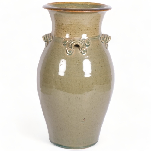 206 - A large studio pottery vase with 4 lugged handles, makers mark to base, height 38.5cm