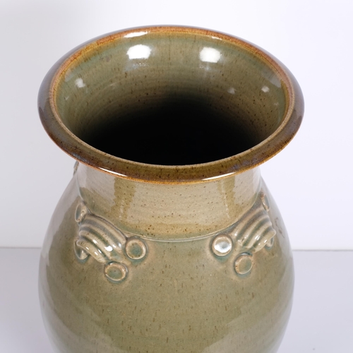 206 - A large studio pottery vase with 4 lugged handles, makers mark to base, height 38.5cm