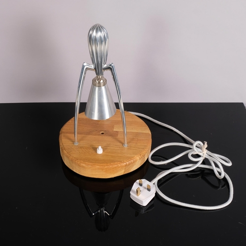 211 - A Philippe Starck aluminium juicer, converted into a table lamp on oak base, 33cm