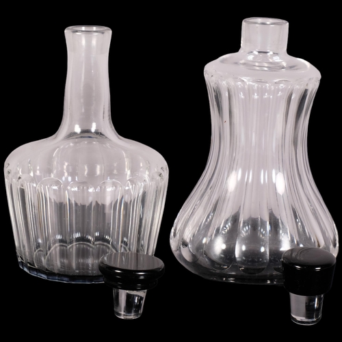 223 - Simon Gate for Orrefors, two fluted pattern decanters with black glass foot and stopper, 1920s/30s d... 