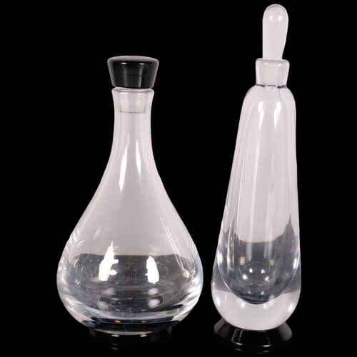 224 - Orrefors, Sweden, two decanters with black foot, both marked to base Orrefors, slim decanter HN 137/... 