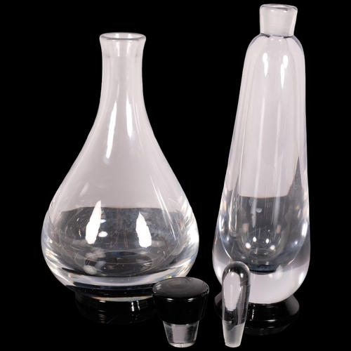 224 - Orrefors, Sweden, two decanters with black foot, both marked to base Orrefors, slim decanter HN 137/... 